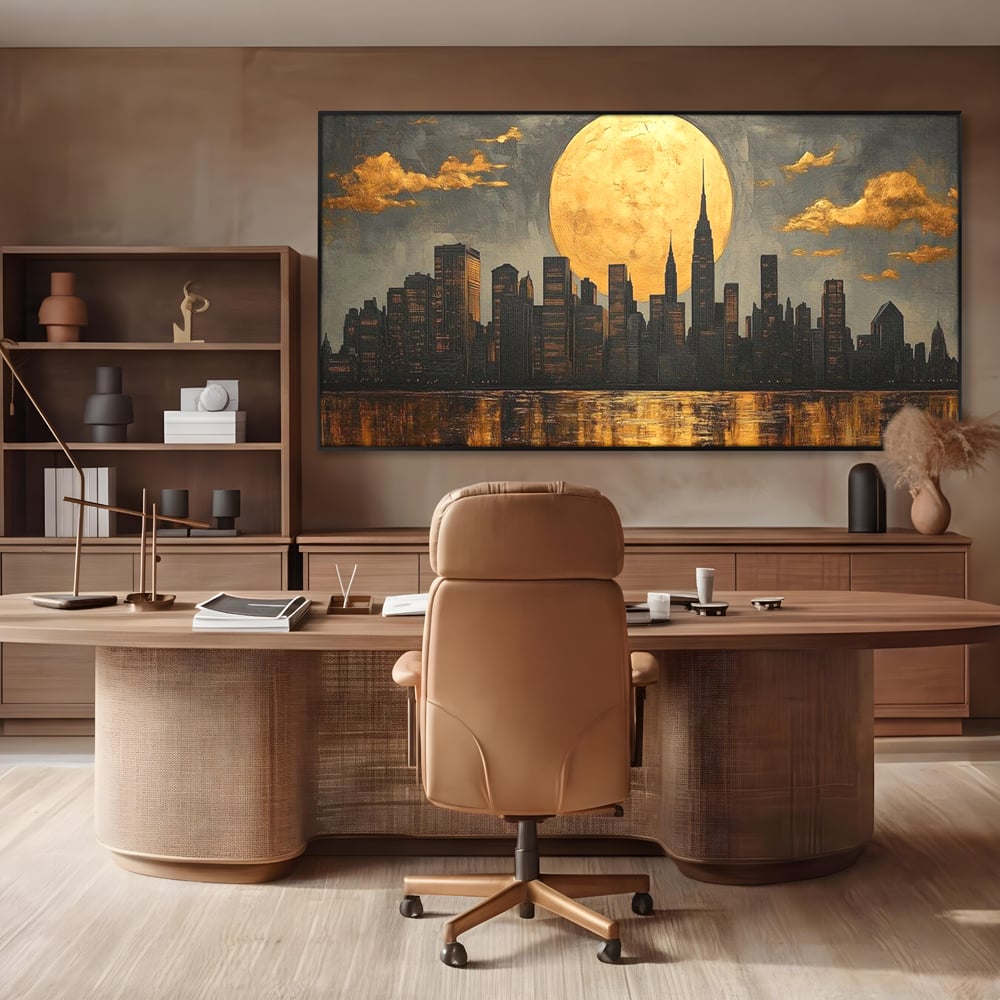 Tablou canvas cu pictura orizontala cu metropola si luna aurie, in rama de aluminiu negru, pe perete intr-un birou